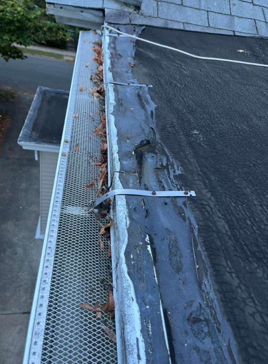 Gutter with leaf guard needing professional repair